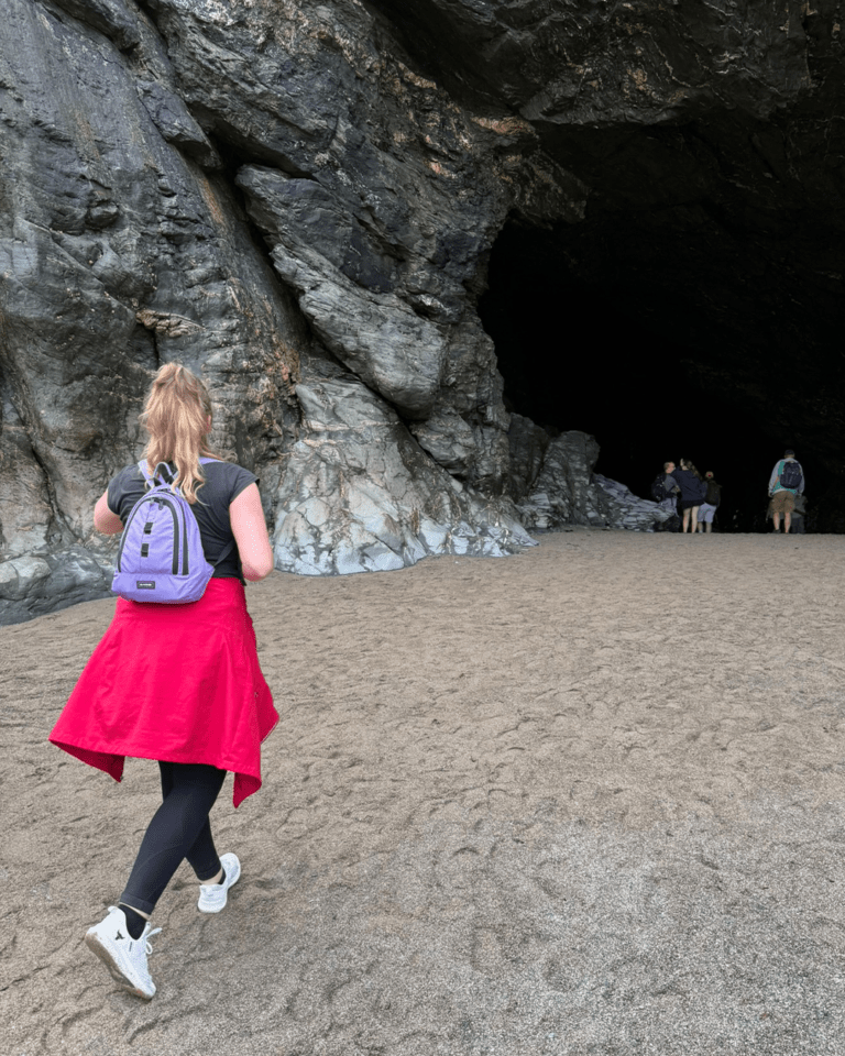 Caroline Green enters Merlin's Cave in Tintagel, UK.